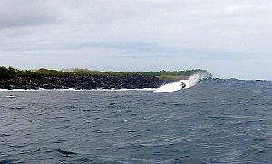 Andresito works one down the point at Chicken Hill in the Galapagos Islands.